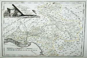 Ein altes Deutschland-Karte in einem Photo-Rahmen, mit einem Haus in der Mitte umgeben von Straßen, Städten und geografischen Merkmalen.