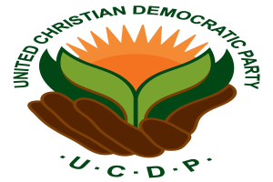 Logo der Vereinigte Christdemokratische Partei (UCDP): eine Hand, die eine leuchtend gelbe Blume mit einem grünen Stiel und Blättern hält, mittig innerhalb eines blauen und gelben Kreises auf einem weißen Hintergrund, mit der Beschriftung "UCDP" in fetter schwarzer Schrift darunter.