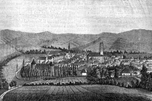 Eine Schwarz-Weiß-Zeichnung einer kleinen Stadt in einem Tal, umgeben von Bäumen und Hügeln, mit dem Text "Bayern, Deutschland, 1857" oben.